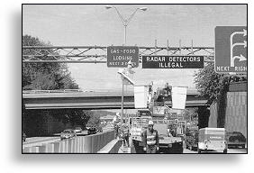 workers repairing an overhead sign