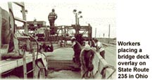 Workers placing a bridge deck overlay on State Route 235 in Ohio 