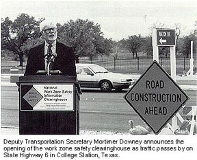 deputy transportation secretary mortimer downey announces the opening of the work zone safety clearinghouse as traffic passes by on the state highway 6 in college station, texas.