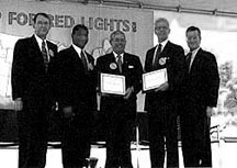 From left to right: FHWA Administrator Kenneth R.Wykle, U.S. Transportation Secretary Rodney E. Slater, Chrysler CEO Bob Eaton, ATS Executive Director Harry Teter, and NHTSA Administrator Ricardo Martinez