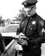 Police officer writing ticket