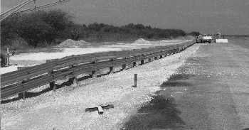 Buried-in-backslope guardrail terminal after crash test.