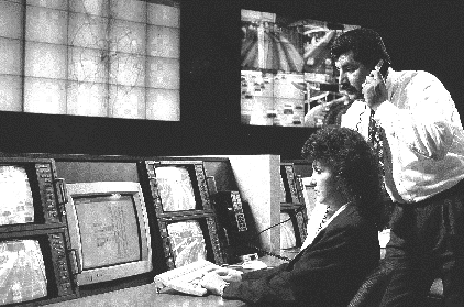 Man and woman at traffic control system