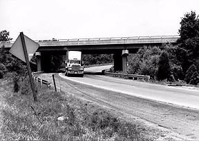 Truck driving under an overpass