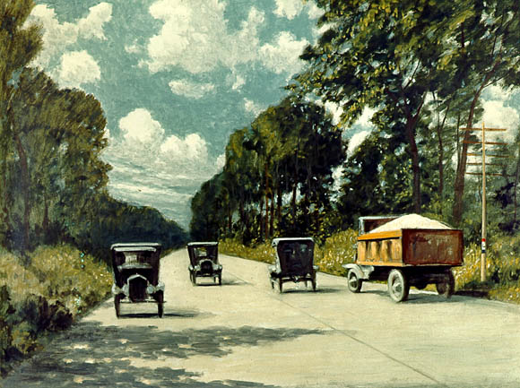 Image: Period cars and a truck travel down a concrete road.