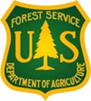 USFS Logo, which is in the shape of a badge. It features an evergreen tree at center with the letters "U" and "S" to each side of the tree. It reads, "Forest Service Department of Agriculture."