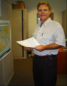 This is a photo of Layne Patton standing in an office.