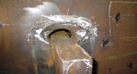 Figure 1 Pile 2 plate F upper opening with runoff tabs removed and surface ground
