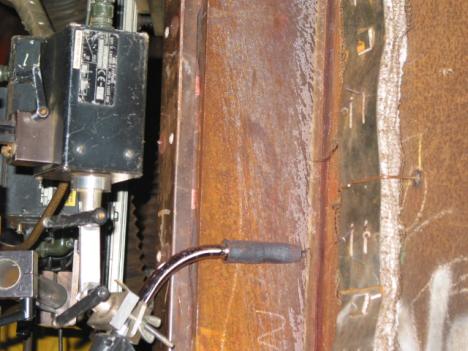 Figure 4 Pile 3 plate D showing welding unit attached to pile sleeve with Buggo unit 