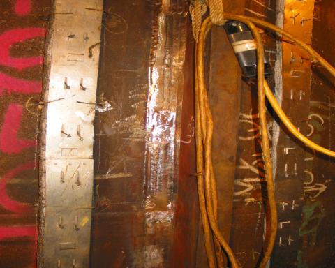 Figure 7 Pile 5 plate D showing regions of weld repair on the cap weld surface.