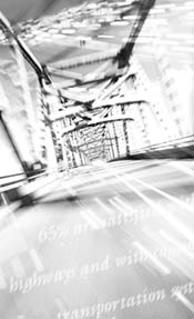 Black and white photo of an empty suspension bridge viewed from the road