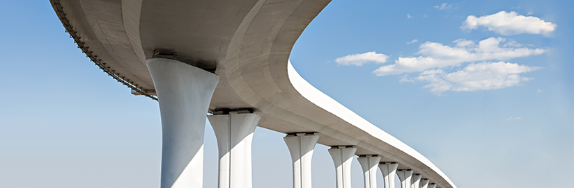 Underside of overhead freeway supported by pillars stock photo. (Source: Wastersoul - istockphoto)