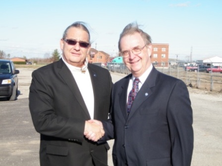 Photo of Osage Nation Assistant Chief BigHorse with FHWA Illinois Division Administrator Norm Stoner at Feature 2000 Preservation Area. (Photo by the Illinois State Archaeological Survey.)