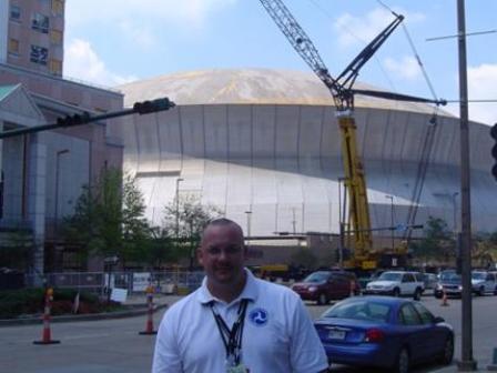 Photo: Keith Lynch in front of Superdome in New Orleans after Hurricane Katrina
