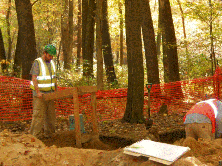 Photo of an unidentified archeologists screening soil from the U.S. 231 site. 