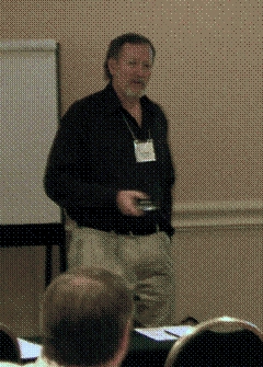 Caption: Dave Gamble standing in front of a classs during Section 4(f) training at the National Field Conference. Photo by Don Cote.