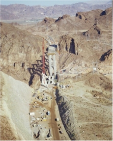 This photo shows the Colorado River bridge under construction, a part of CFLHD’s complex Hoover Dam Bypass project.  (CFLHD photo)  