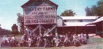 Photo of Dockery Farms building with people on motorcycles in front.