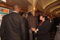 Eisenhower Fellows Rashe Dean and Kenneth King conversing with OTS Director at Poster Session I