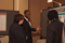 Eisenhower Fellows Rashe Dean and Kenneth King conversing with OTS Director, Ms. Amy Lucero at Poster Session I