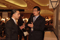 Eisenhower Fellows Shiyun Wang conversing with visitor at Poster Session I