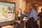 Eisenhower Fellow Amanda Gunnell conversing with visitor at Poster Session I
