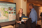 Eisenhower Fellow Amanda Gunnell conversing with visitor at Poster Session I