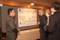 Eisenhower Fellow Daniel Estrada conversing with visitors at Poster Session I