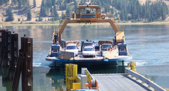 photo of a ferry boat with cars at the ferry dock