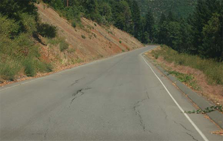 Pavement damage at slide area