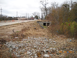 Box culverts were constructed in the roadside drainage ditch after water, gas, and three conduits were relocated.