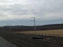 Cross-arms on power poles were cantilevered over the right-of-way to prevent aerial encroachments over private property.