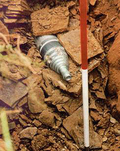 Figure 15 on this page is a picture of stepped cone impact moling head emerging at the reception pit.