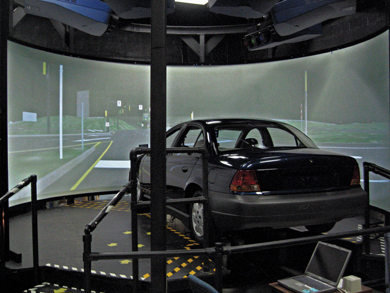 FHWA's Highway Driving Simulator, shown here, enables engineers to develop a design and then have potential end users test drive the proposed facility early in the design process.
