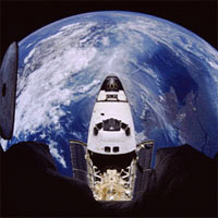 Photo: Shuttle and Earth.